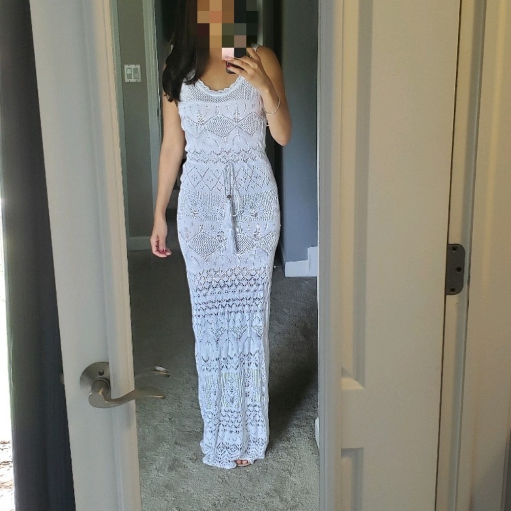 Venus white knit dress with nude underlay.